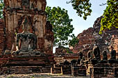 Ayutthaya, Thailand. Wat Mahathat, detail of a small vihara with a chedi and a Buddha image near the eastern side of the eclosure